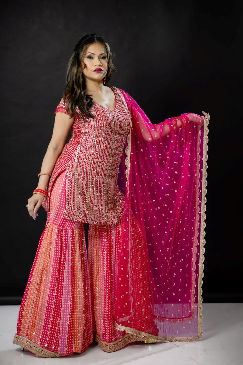 Gharara suit, designer gharara suits, bridal gharara suit, traditional gharara, gharara suit online, party wear gharara, Pakistani gharara suits, gharara dress, latest gharara designs, wedding gharara suit, embroidered gharara, heavy gharara suits, festive gharara, gharara suit for women, ethnic gharara.